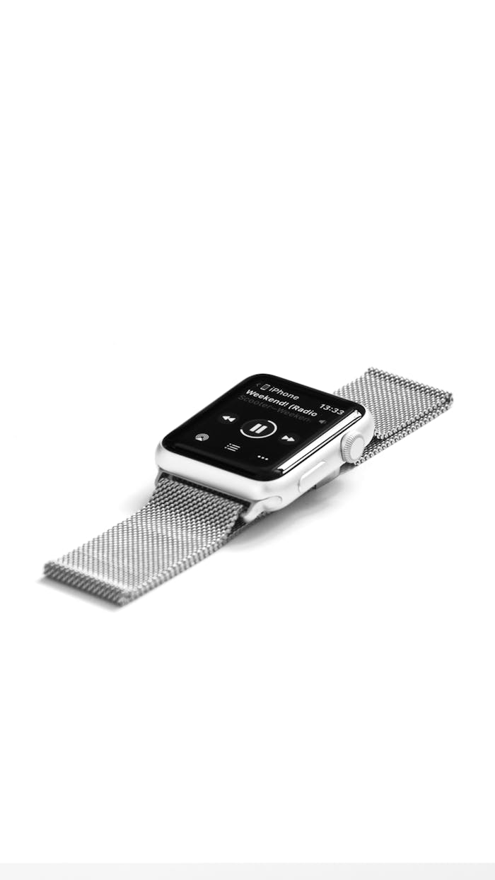 Home Modern smartwatch with sleek metal band displayed on white background.